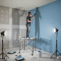 A person performaing Painting Services