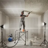 A person performaing Ceiling Texture