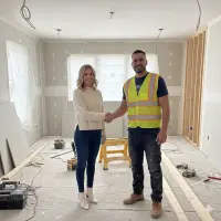 An image of an Ace employee shaking hands with a satisfied customer.